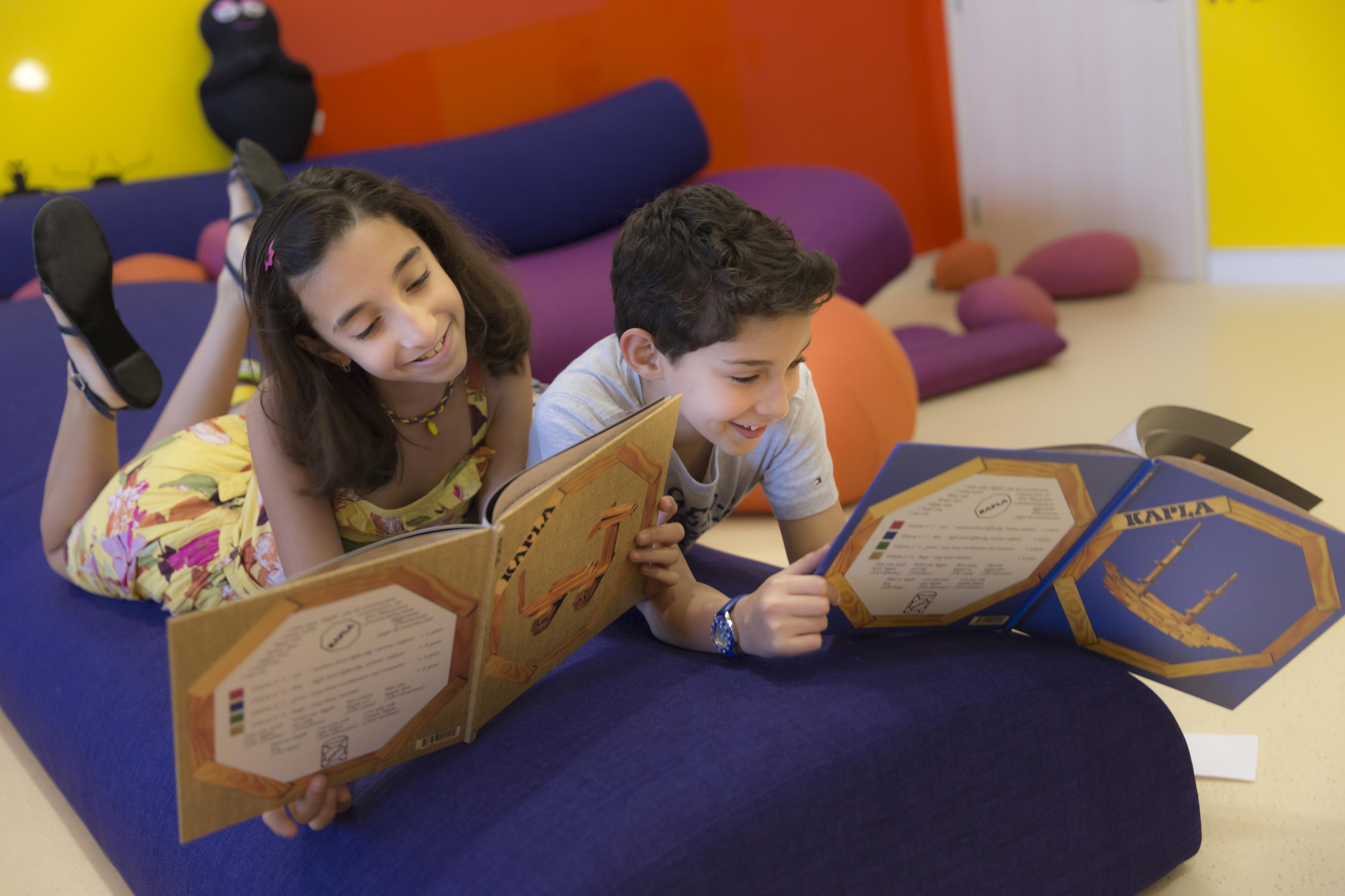 Novotel Abu Dhabi Al Bustan Esterno foto A child reading a book about the solar system