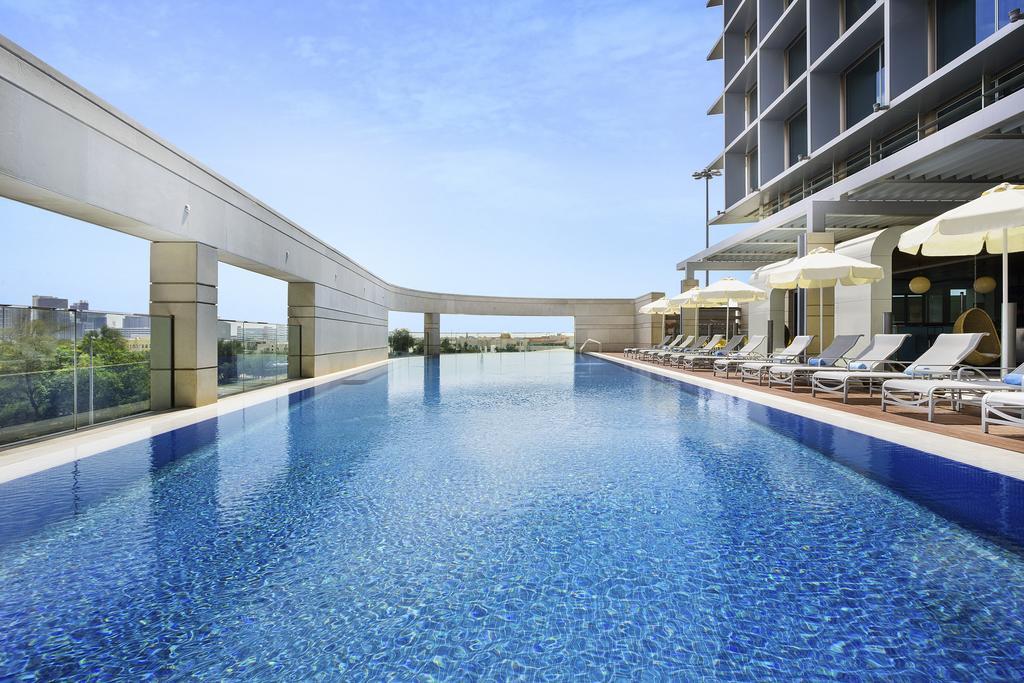 Novotel Abu Dhabi Al Bustan Esterno foto Swimming pool